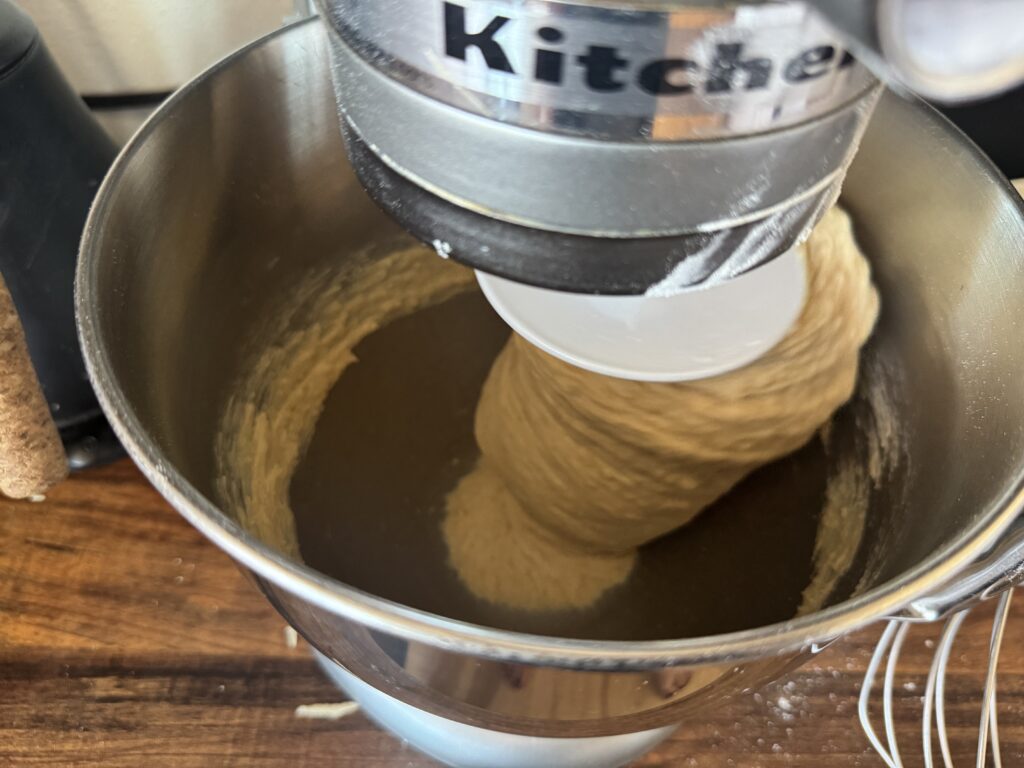 hamburger bun dough kneading in a kitchenAid mixer