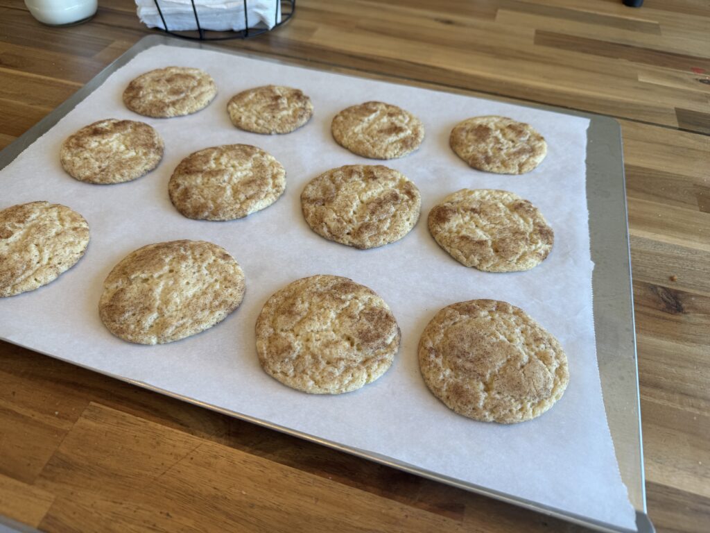 fresh out of the oven cookies on a cookie sheet with parchment paper